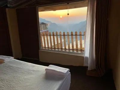 a room with a bed and a window with a view at Dana Trail Cottages in Dana
