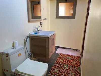 a bathroom with a sink and a toilet at Dana Trail Cottages in Dana