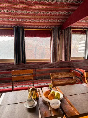 a room with a table with a bowl of fruit on it at Dana Trail Cottages in Dana