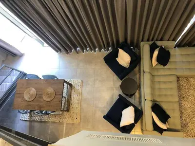 a room with a counter with pillows on a wall at luxury apartment in boulevard in Amman