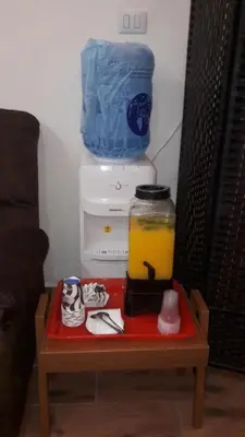 a small table in front of a small refrigerator at Mesha Stele Private Hotel in Madaba