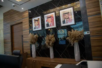 a room with three vases with pictures on a wall at Jeddah Homes Boutique Hotel in Amman