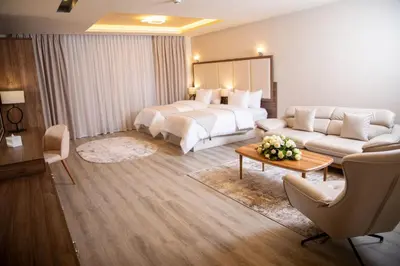 a hotel room with a bed and a couch at Jeddah Homes Boutique Hotel in Amman