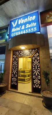a front door of a store with a sign on it at Venice in Aqaba