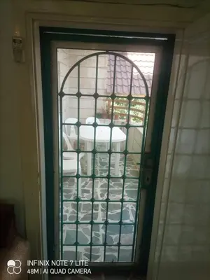 a glass door with a rack of dishes at Decapolis in Irbid