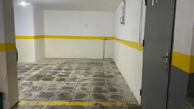 an empty room with a tile floor and a door at Abdoun Apartment in Amman