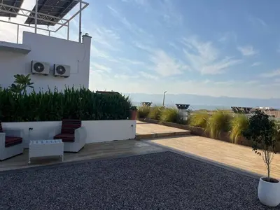 a balcony of a house with a view of the ocean at AQABA PRO DIVERS in Aqaba