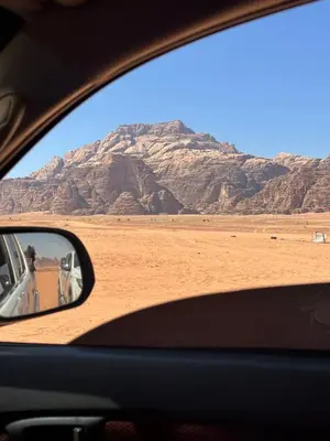 a view of a desert from a car window at Full moon camp in Wadi Rum