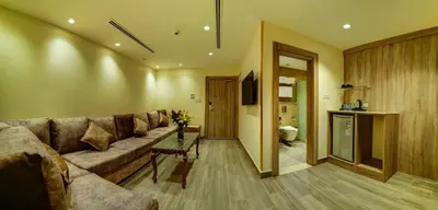 a living room with a couch and a table at De-Lara hotel in Aqaba