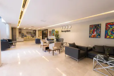 a lobby of a hospital with couches and chairs at Boho Boutique Hotel Amman in Amman