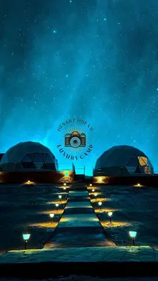 a group of domes with lights on the beach at night at RUM DREAM BUBBLES lUXURY CAMP in Wadi Rum