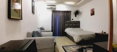 a small living room with a couch at MK1 - Studio Stay in Amman