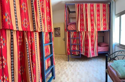 a room with two bunk beds and a window at Extra Traveller in Aqaba