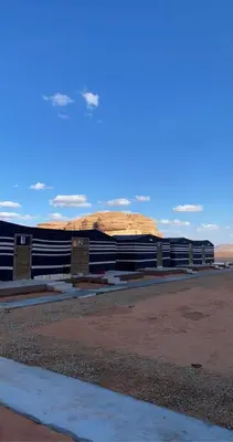 a group of bleachers in front of a building at Wadi Rum Sand Camp in Disah