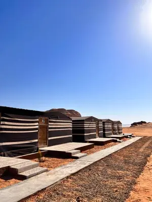 a row of barracks in the desert at Wadi Rum Sand Camp in Disah