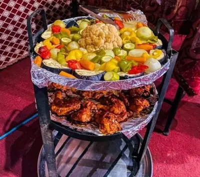 a display of different types of food on a stand at Awad Bedouin camp in Wadi Rum