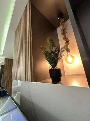 a potted plant sitting on a shelf in a room at modern apartment in abdoun-amman in Amman