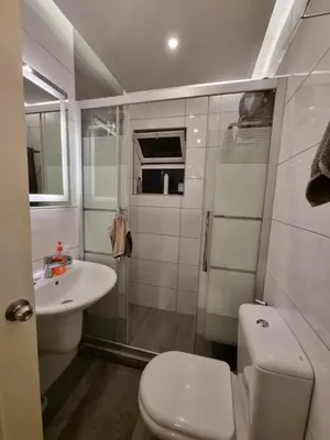 a small bathroom with a toilet and a sink at MK3 - Two Bedroom Apartment in Amman