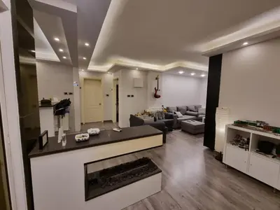 a living room with a couch and a fireplace at MK3 - Two Bedroom Apartment in Amman