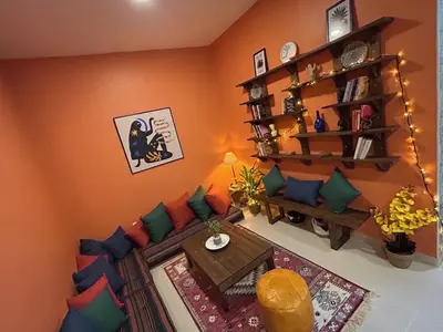 a living room with a couch and a table at Medusa Home Stay in Amman