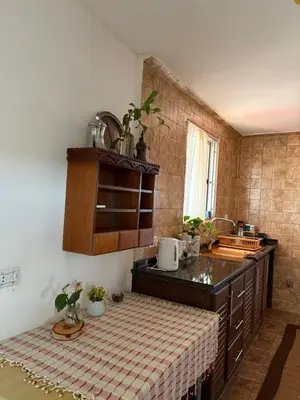 a kitchen with a sink and a counter top at Simple home in Madaba