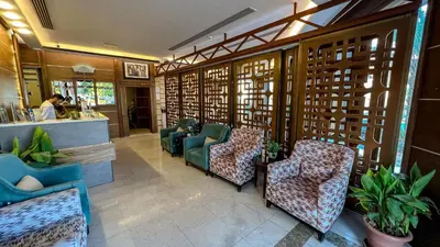 a lobby of a restaurant with chairs and a counter at Yafko Hotel in Aqaba