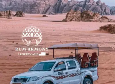 a white truck with chairs in the desert at Armony rum camp in Wadi Rum