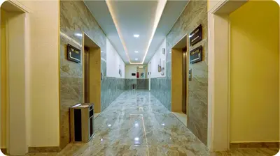 a hallway of a building with a hallwayngth at Three Palms Suites in Aqaba