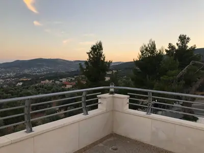 a view from the balcony of a house at The Pine Tree Chalet in Jerash
