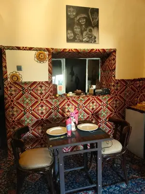 a dining room with a table and two chairs at Grandma's house in Wadi Musa