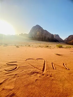 a heart drawn in the sand in the desert at Wadi Rum Spring Moon & Jeep Tour in Wadi Rum