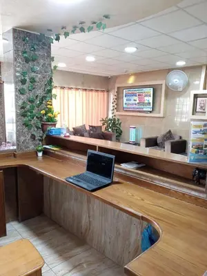 a laptop sitting on a counter in a waiting room at Amir Palace Hotel in Aqaba