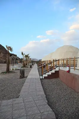 a path leading to a tent on the beach at Bilal luxury camp in Wadi Rum