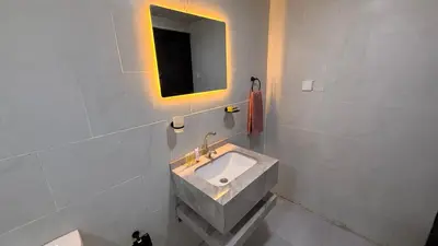 a bathroom with a sink and a mirror at Bedouin Nature Camp in Wadi Rum