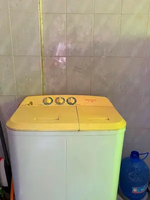 a yellow counter top on top of a white refrigerator at بيت جرش - Jerash House in Jerash