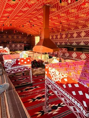 a room with tables and a stove in a room at Milk way desert in Wadi Rum