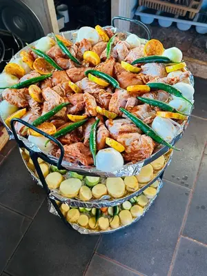 a large platter of food with shrimp and vegetables at Milk way desert in Wadi Rum