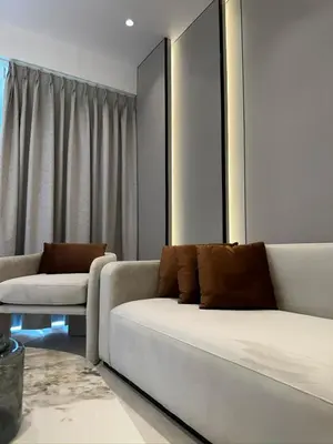 a living room with a white couch and a table at Damac Tower Amman Luxury Apartments - استوديوهات وشقق فاخرة - داماك عمان العبدلي in Amman