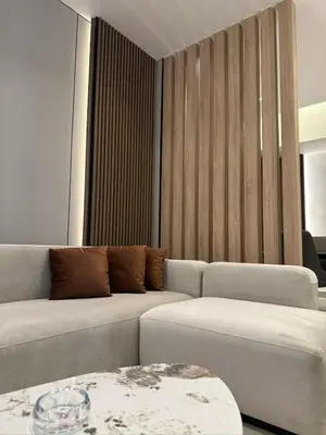 a living room with a couch and a table at Damac Tower Amman Luxury Apartments - استوديوهات وشقق فاخرة - داماك عمان العبدلي in Amman