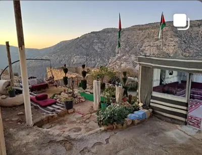 a house with a view of a mountain at My Grandfathers House Dana Heritage and Eco Lodge in Dana