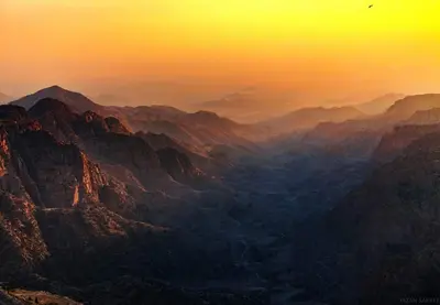 a view of a mountain range at sunset at My Grandfathers House Dana Heritage and Eco Lodge in Dana