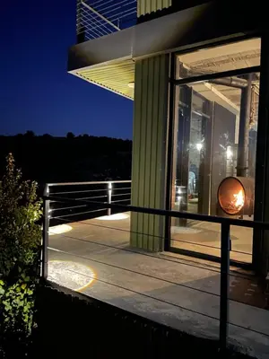 a night view of a building with a window at Shams Farm in Ajloun