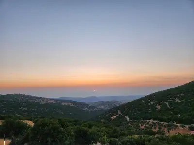 a view of the hills at sunset at Shams Farm in Ajloun