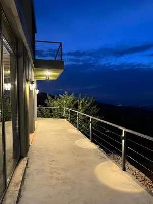 a basketball hoop on the side of a building at night at Shams Farm in Ajloun