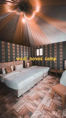 a bedroom with a large bed in a room at wadi novas camp in Wadi Rum