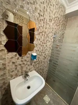 a bathroom with a sink and a shower at apartment 60m 1bedroom for rent2 in Umm Uthainah