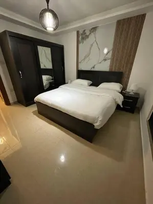 a bedroom with a large bed in a room at apartment 60m 1bedroom for rent3 in Umm Uthainah