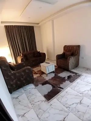 a living room with two chairs and a table at dream house hotel in Jerash