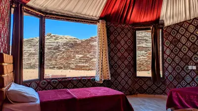 a room with a window with a view of the desert at WhyDesert Camp & Tours in Wadi Rum