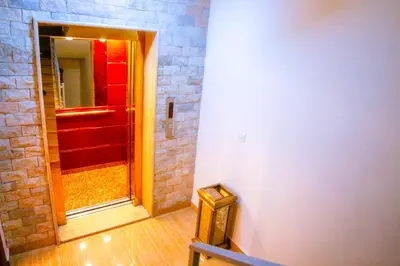 a hallway with a red door in a room at ِAfnan hotel in Aqaba